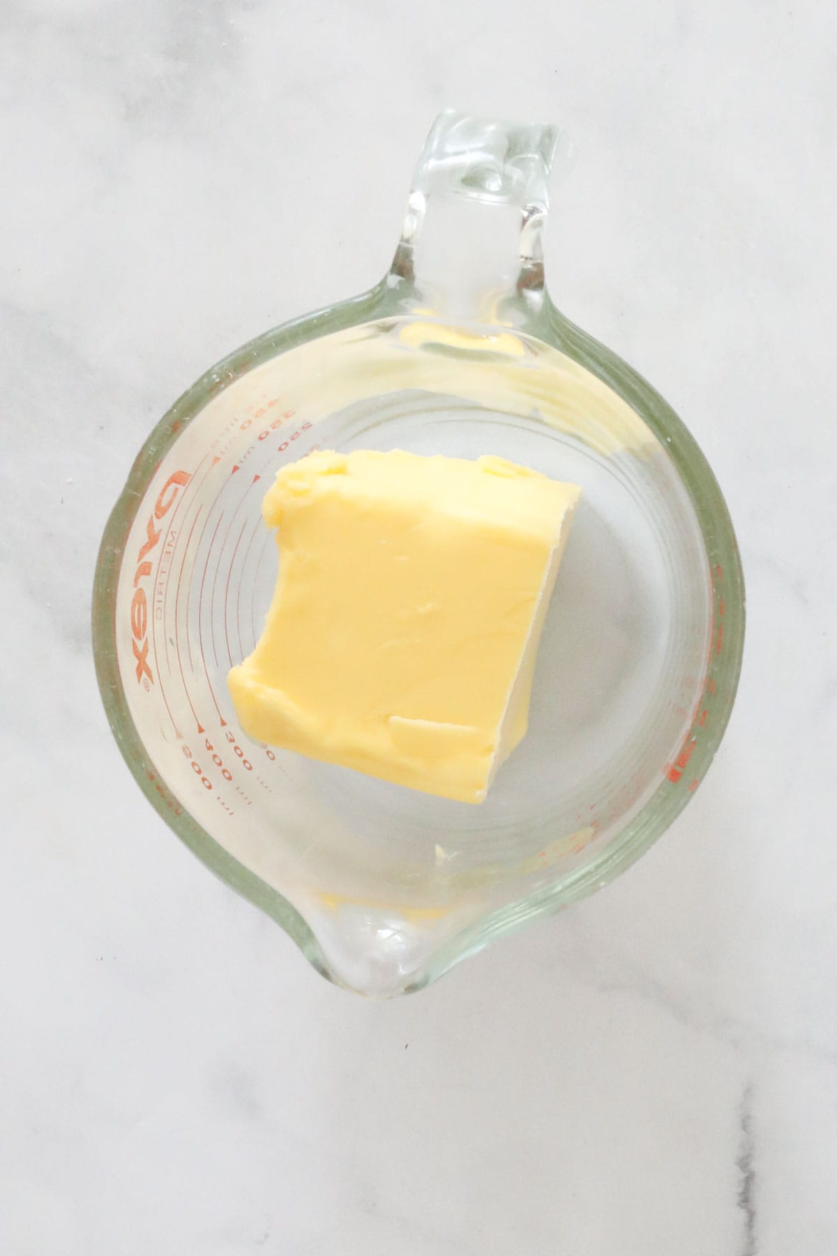 Butter in a heat proof glass measuring jug.