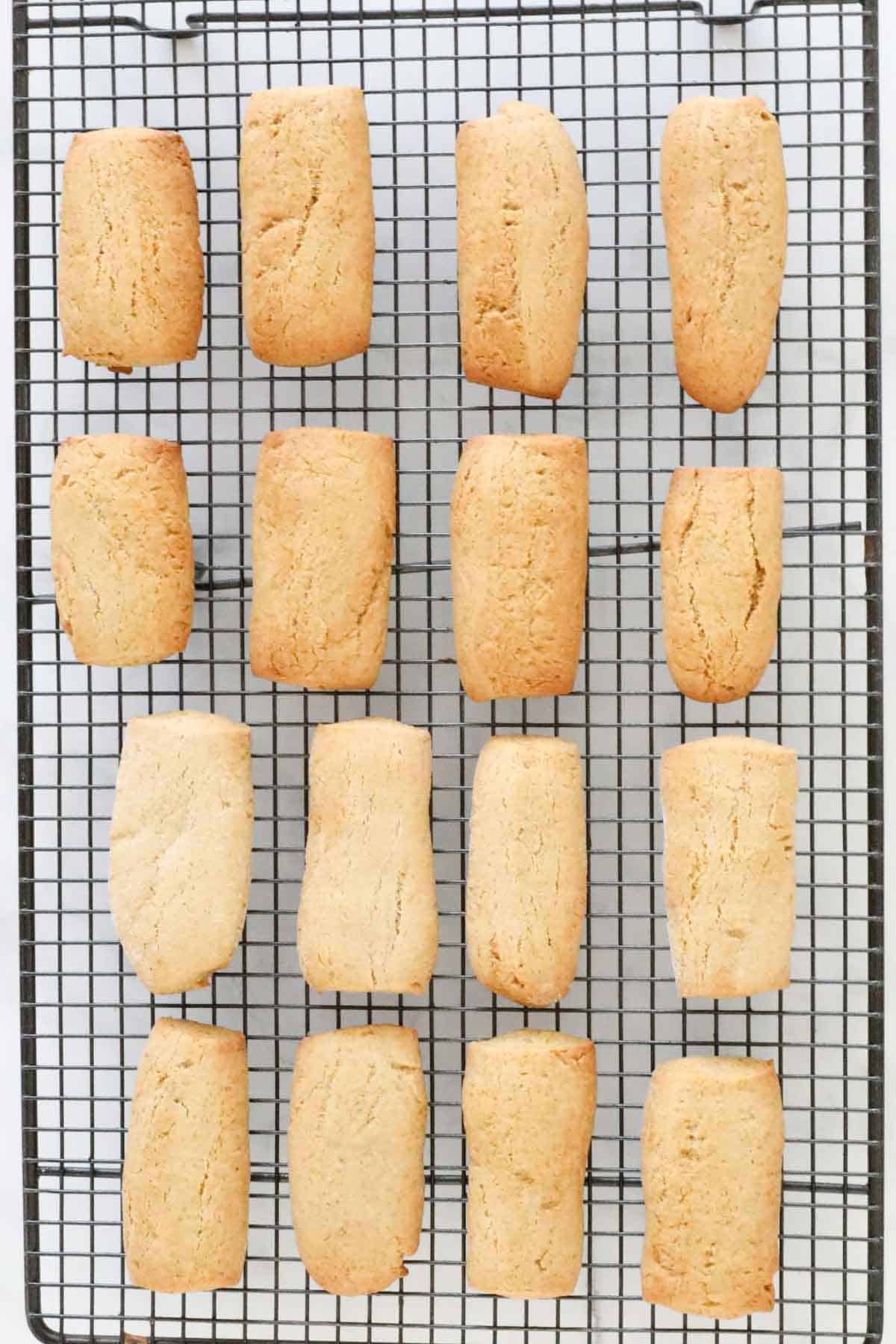 The baked cookies on a metal cooling rack.