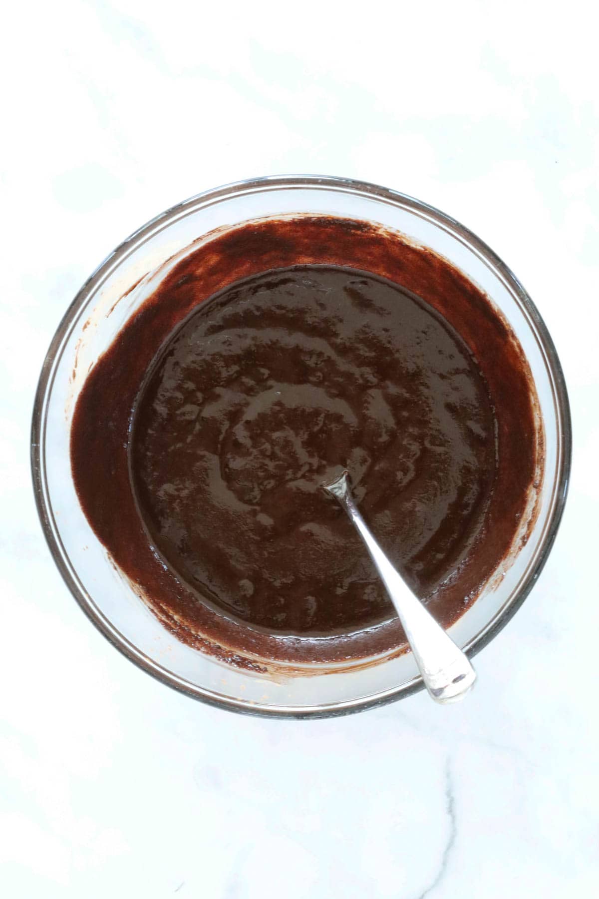 A chocolate mixture in a mixing bowl.