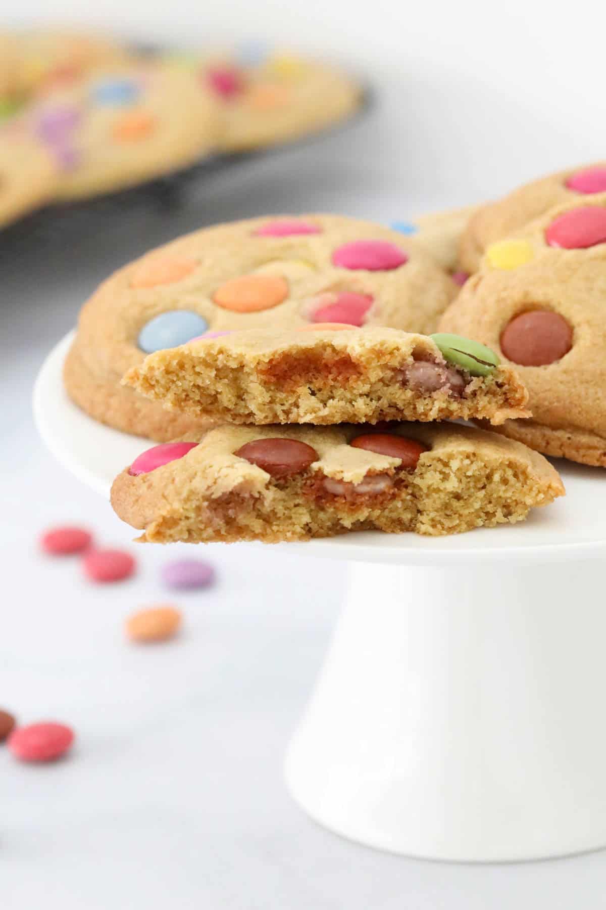 A Smarties cookie broken in half to show the texture.