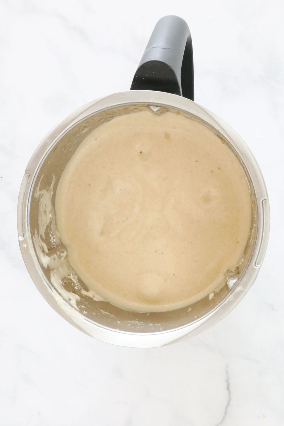 Banana bread batter in a Thermomix bowl.