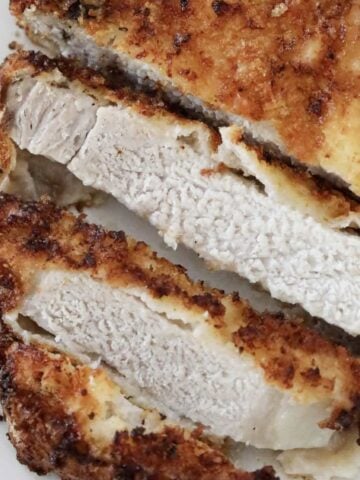 Slices of parmesan and panko crumbed pork chops.