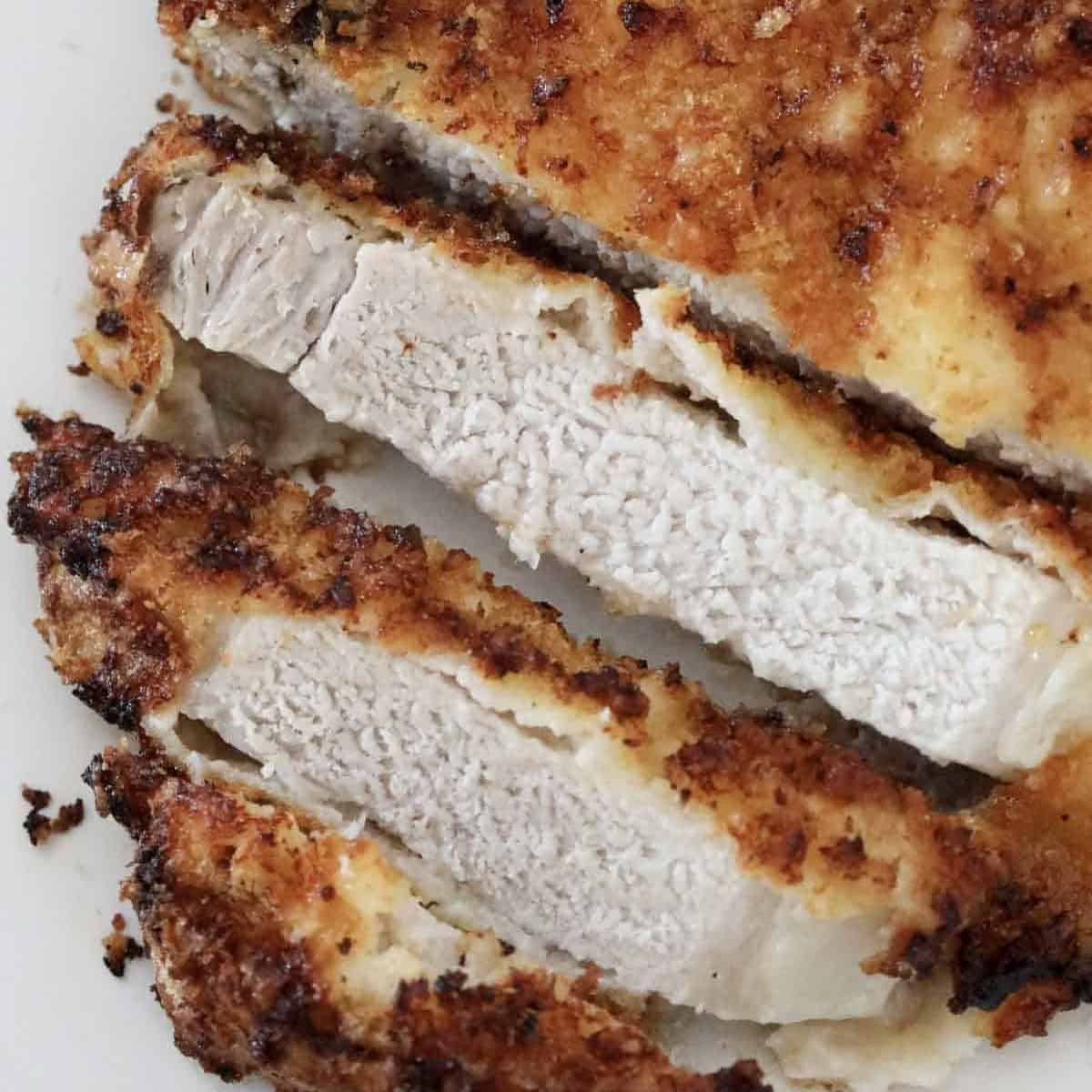 Slices of parmesan and panko crumbed pork chops.