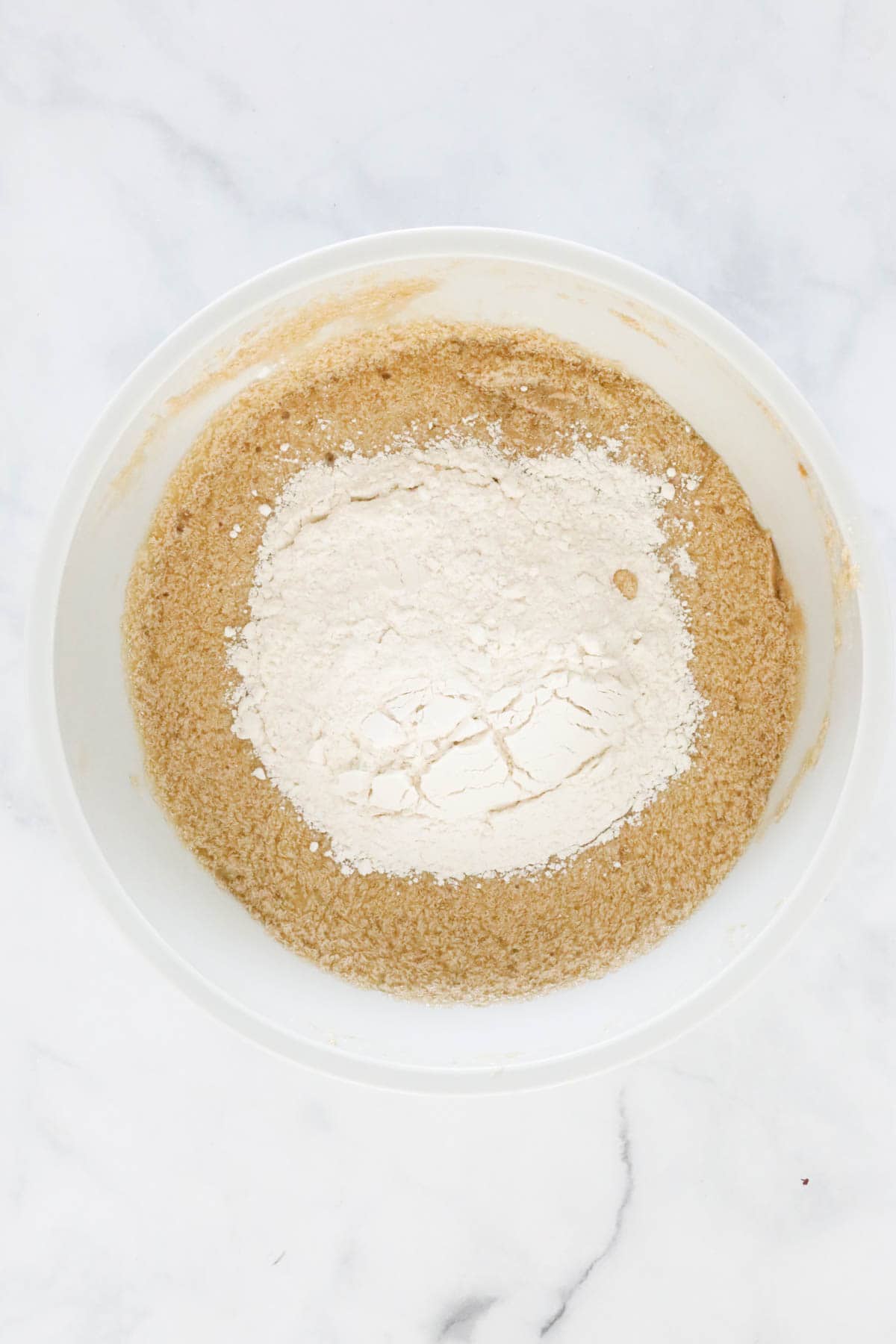 Sifted flour and bicarb soda added to the mixing bowl.