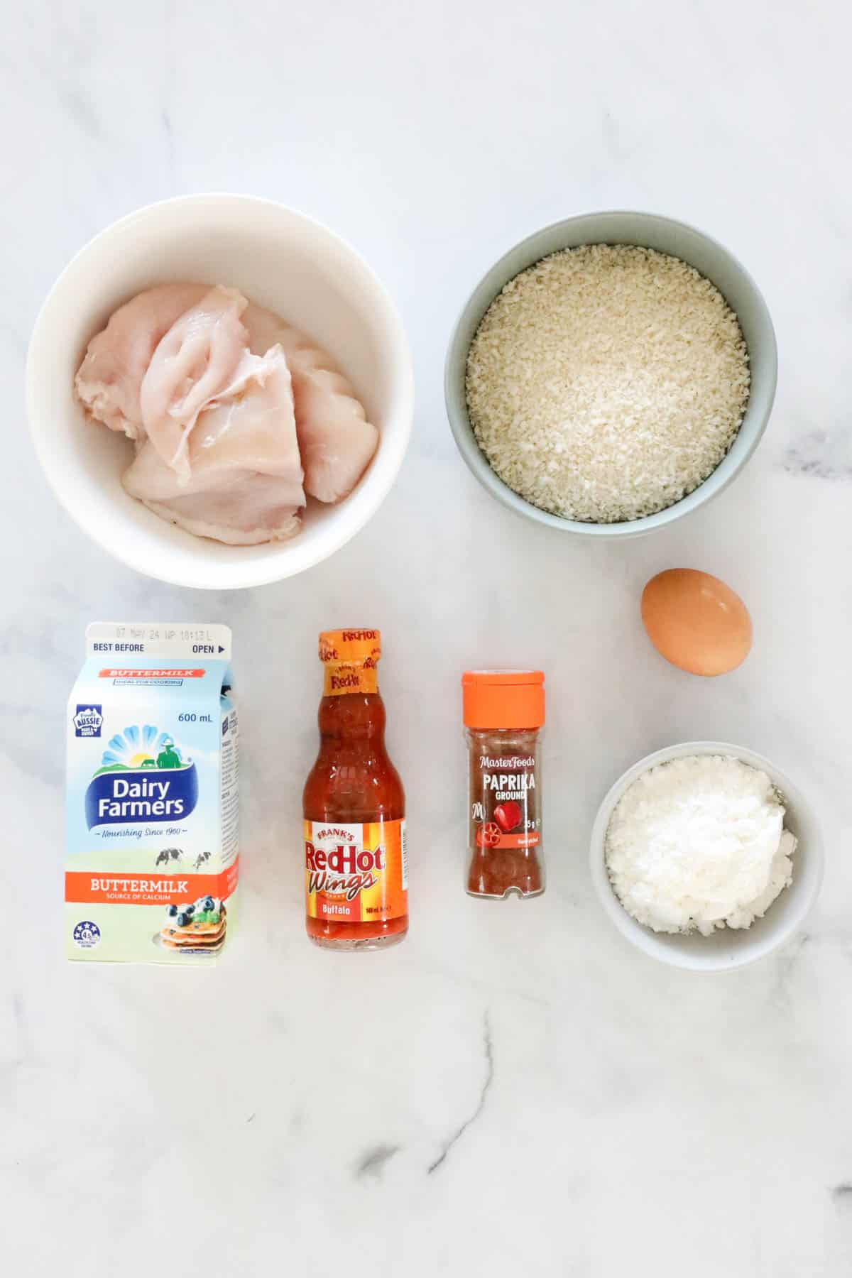 Ingredients needed to make the bang bang chicken placed in individual bowls.