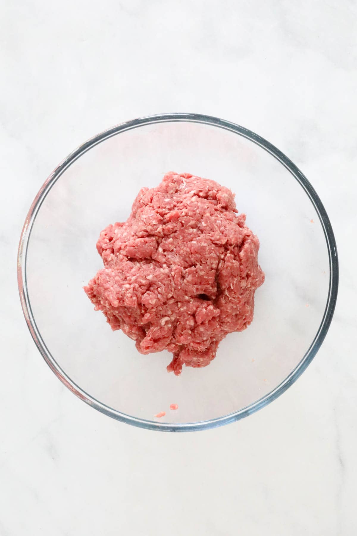 Seasoned beef mince in a bowl.