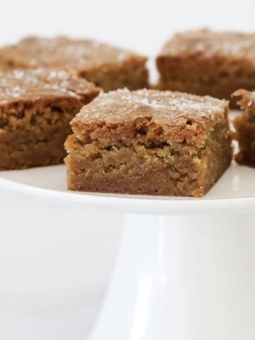 A piece of butterscotch blondie with sea salt on top.