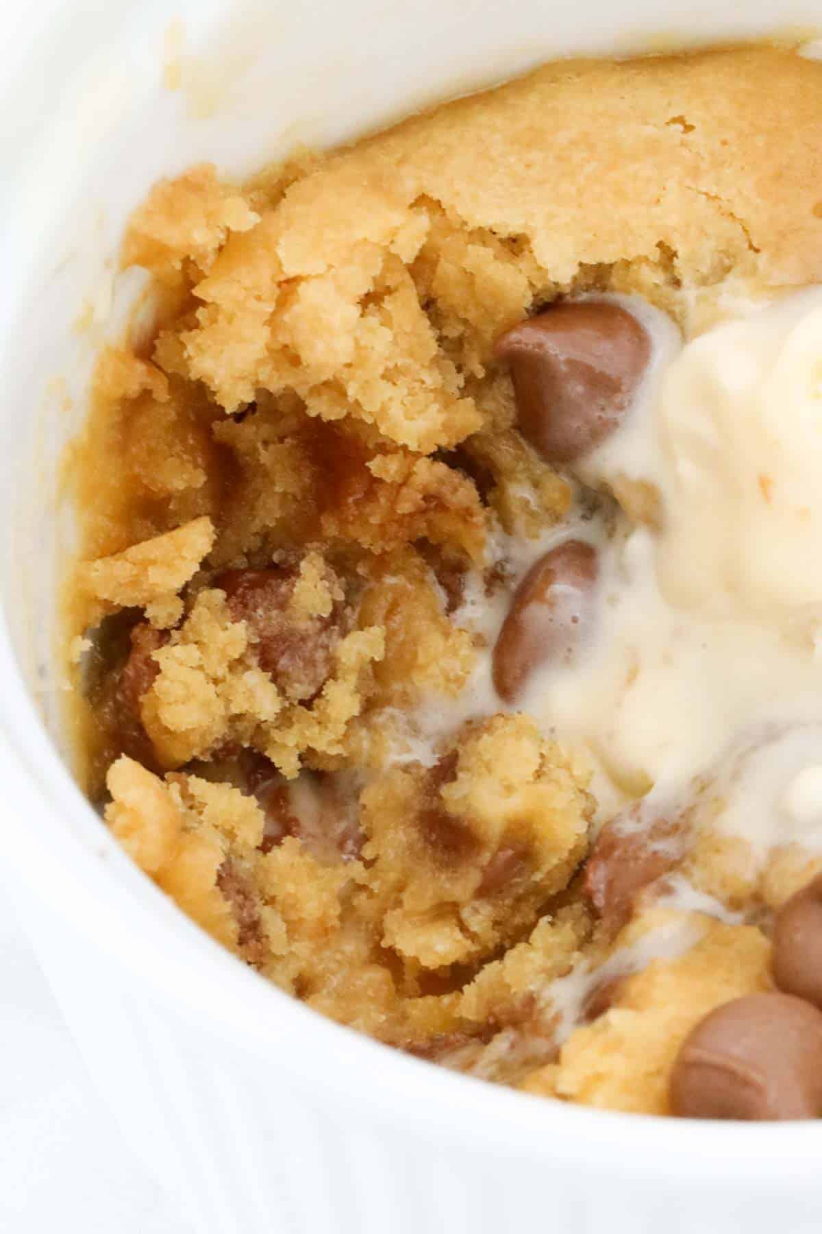 Vanilla ice cream melted into a choc chip cookie mug cake.