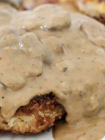 A creamy mushroom sauce poured over crunchy breaded pork chops.