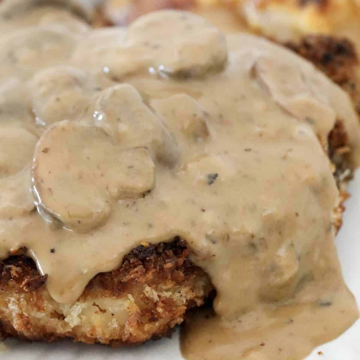 A creamy mushroom sauce poured over crunchy breaded pork chops.