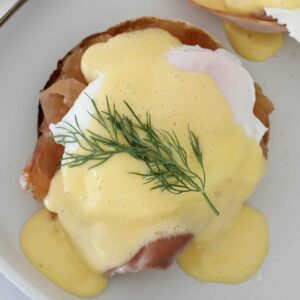 An overhead shot of eggs atlantic with hollandaise sauce.