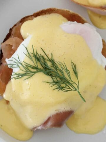 An overhead shot of eggs atlantic with hollandaise sauce.