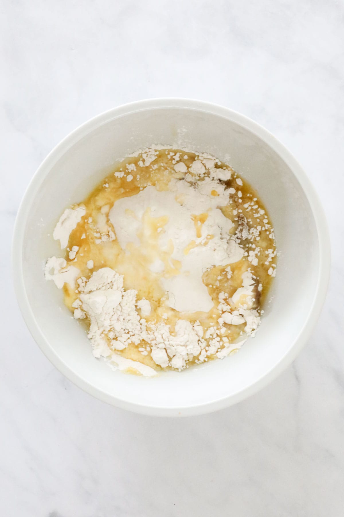 Flour, coconut, brown sugar and melted butter added to the crushed Weet-bix.