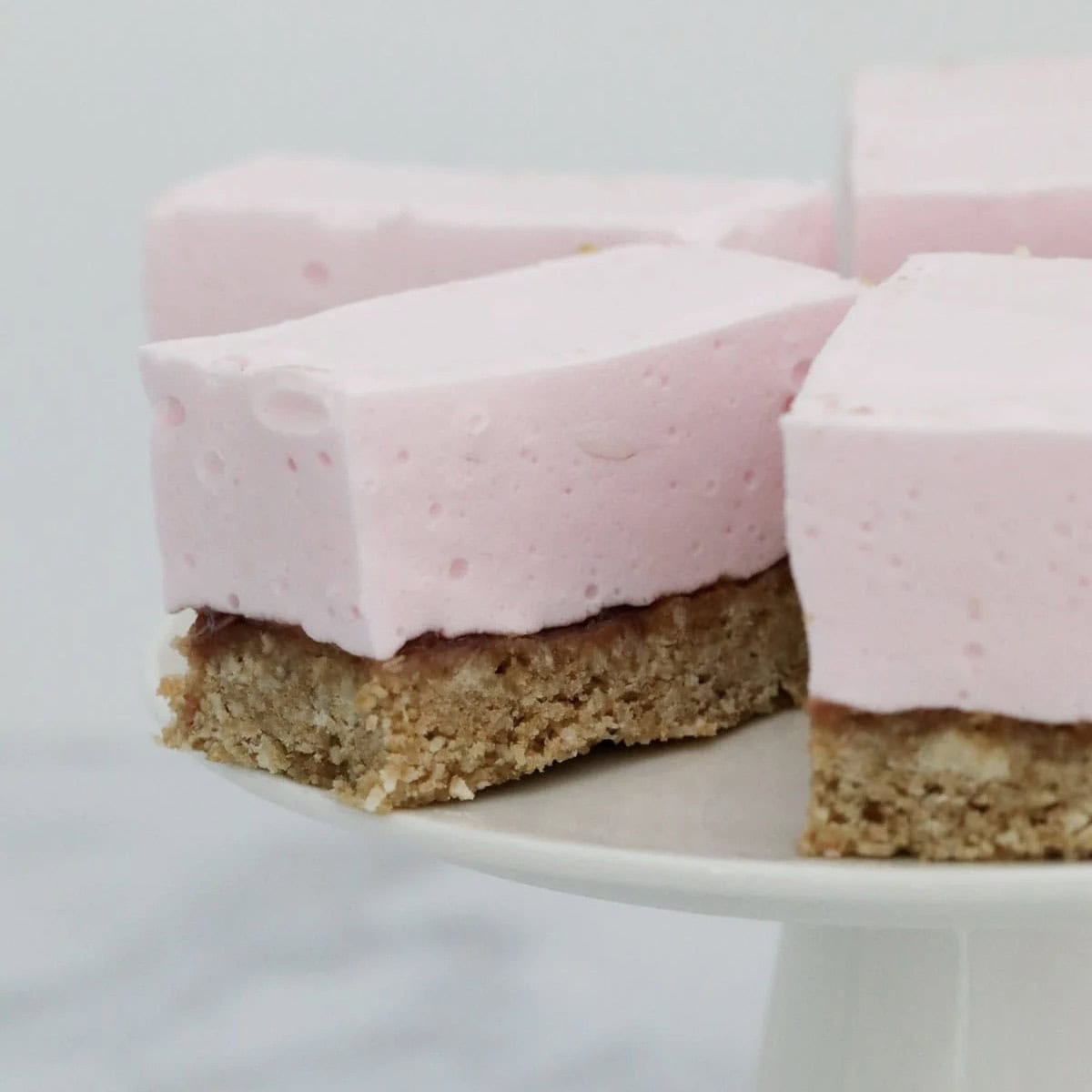 Fluffy marshmallow pink slice with a crunchy wwet-bix base.