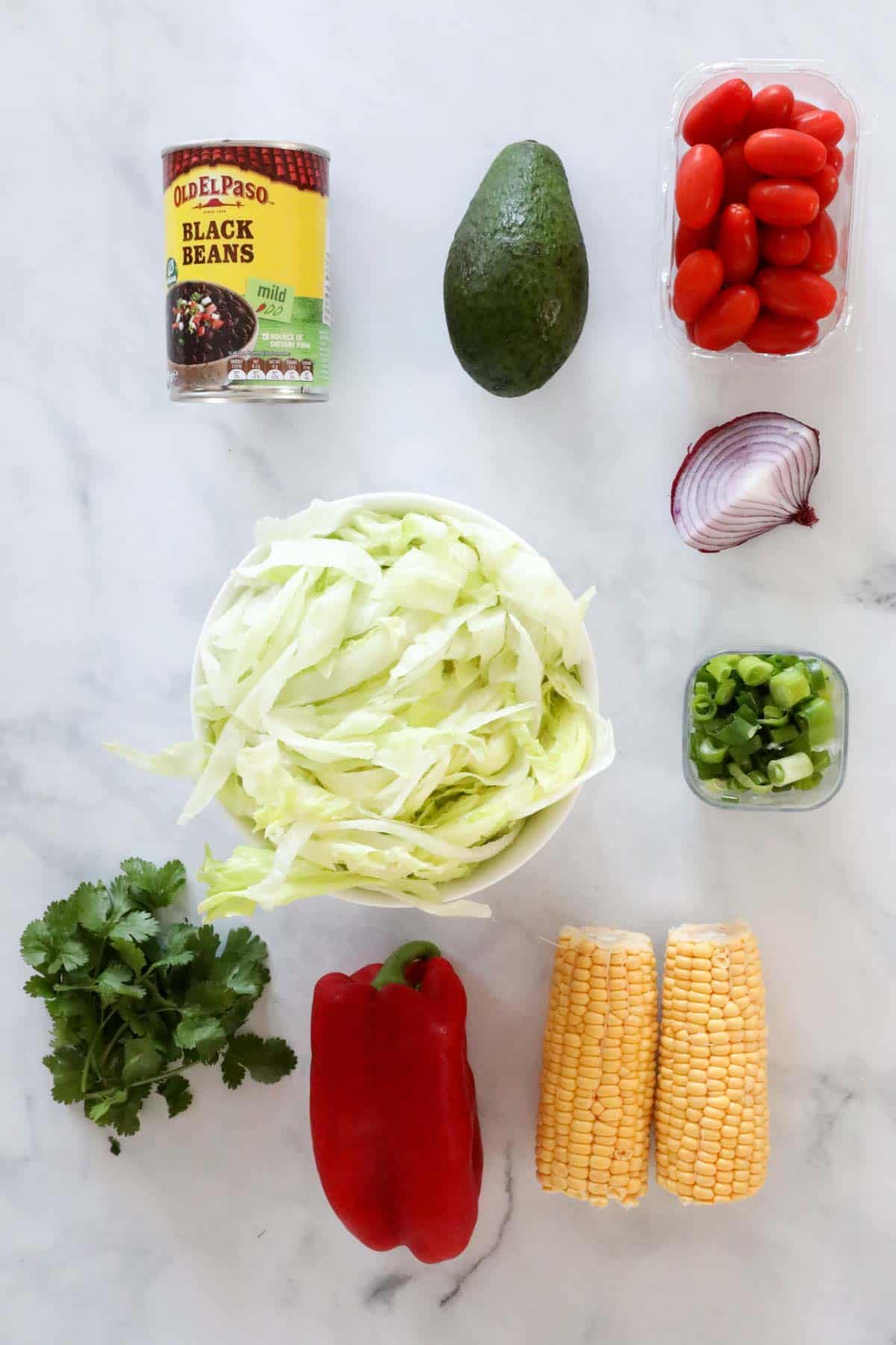 Ingredients needed to make the salad weighed out and placed in individual bowls.