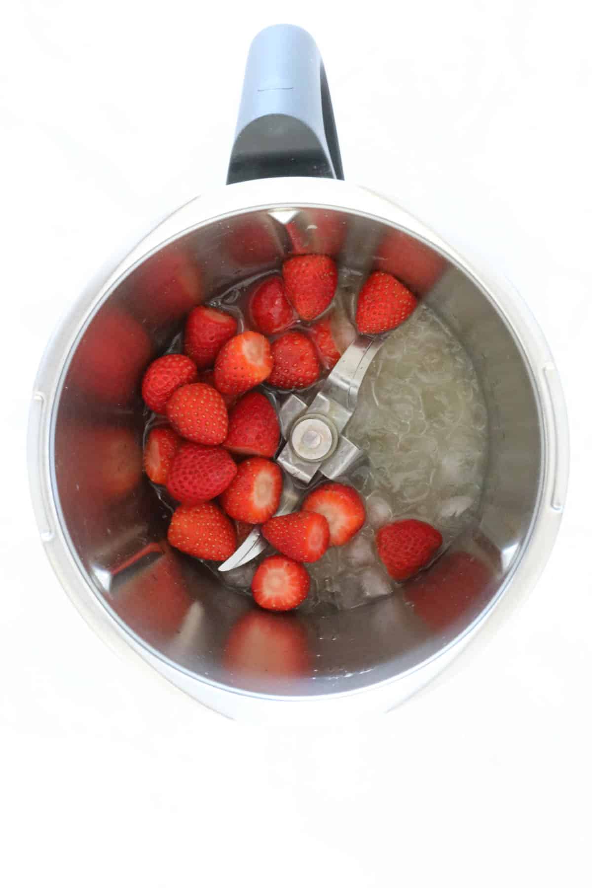 Strawberries, white rum. lime juice, sugar syrup and ice cubes in a blender.