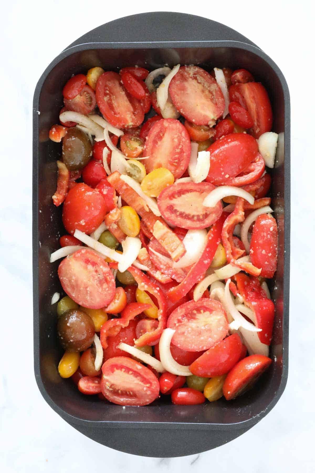 The vegetables placed in a baking dish.