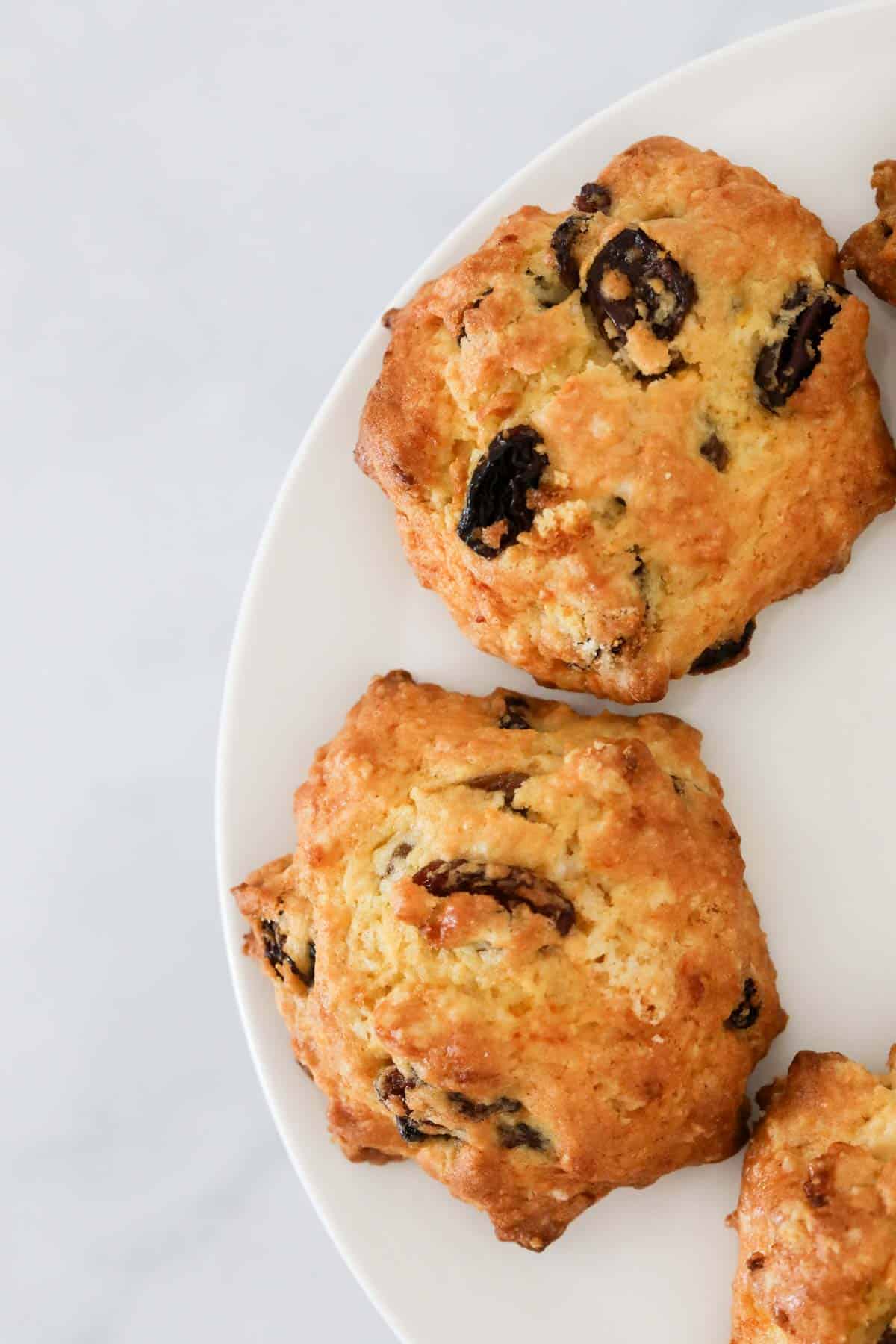 Overhead shot of rock cakes with sultanas on a plate