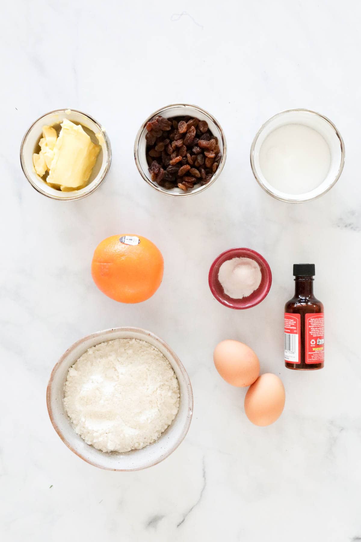 Ingredients needed to make the rock cake recipe weighed out and placed in individual bowls.