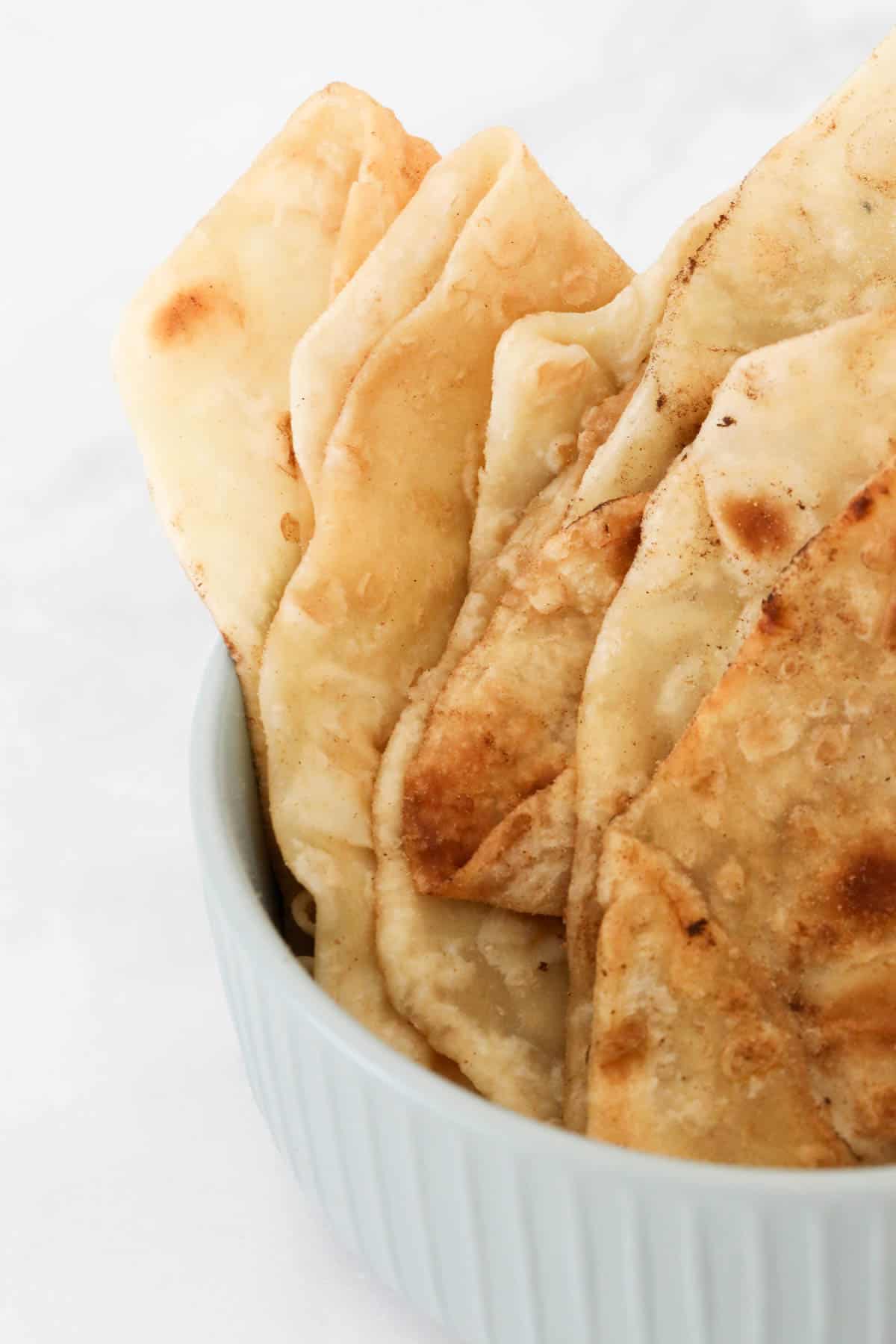 A bowl of folded roti bread.