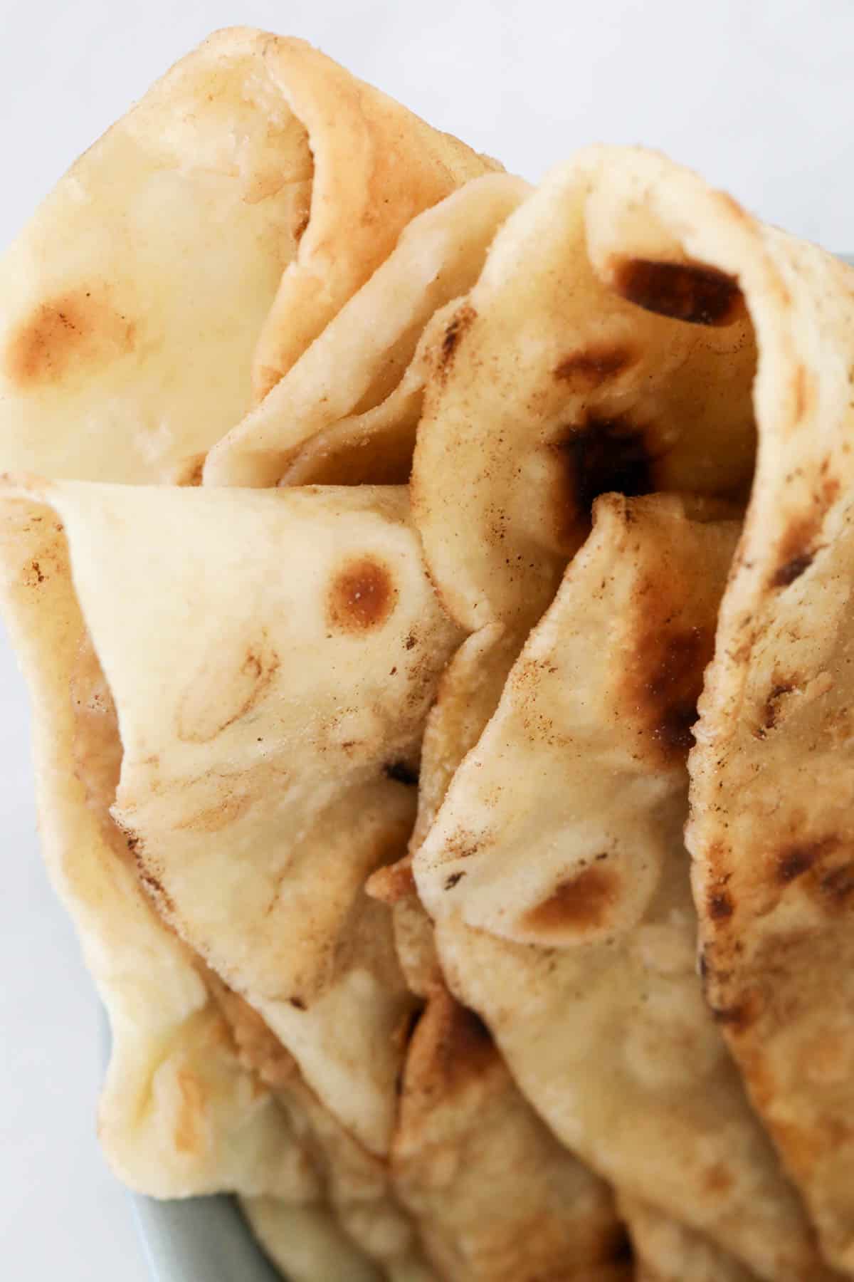 Soft fluffy roti bread folded together. 