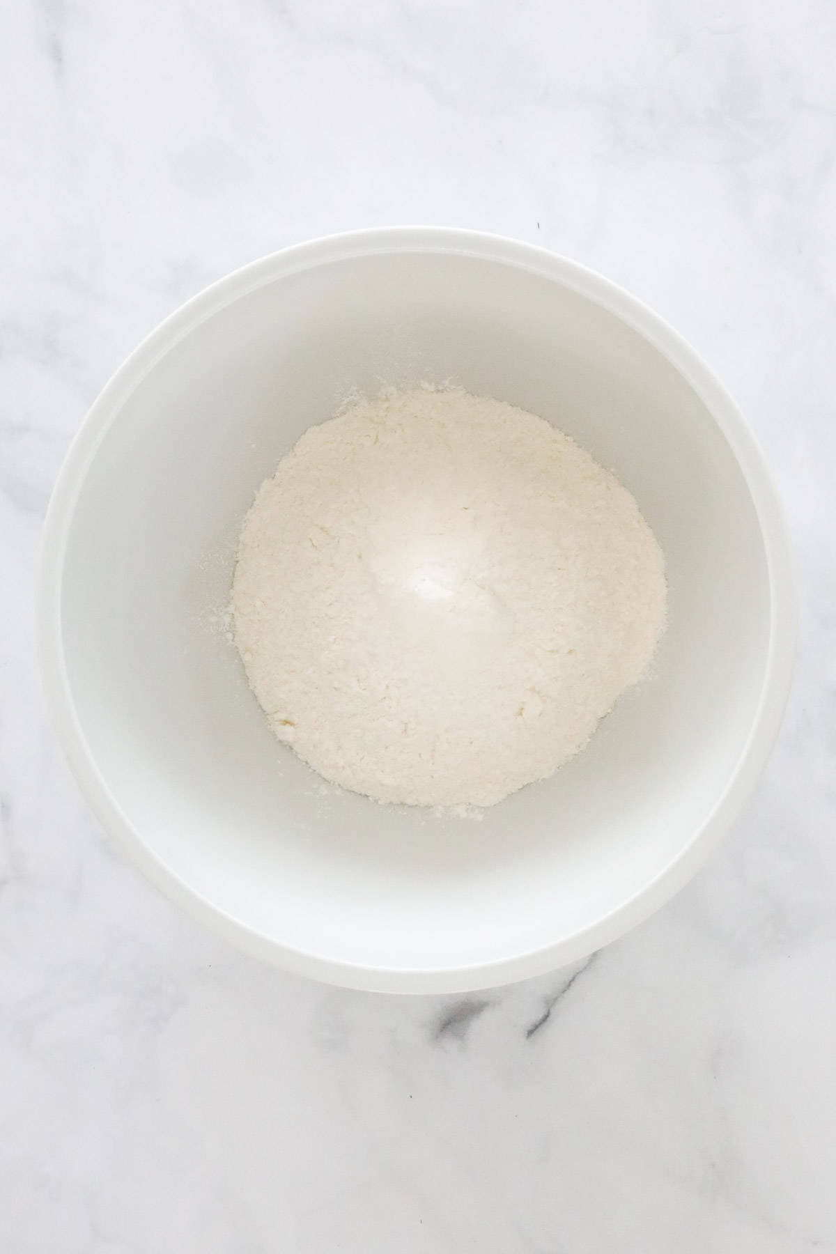 Sifted flour and salt in a mixing bowl.