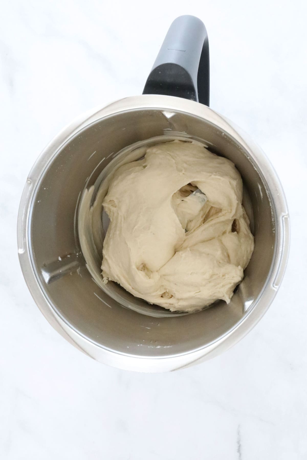 The kneaded dough with a silky texture in a Thermomix.