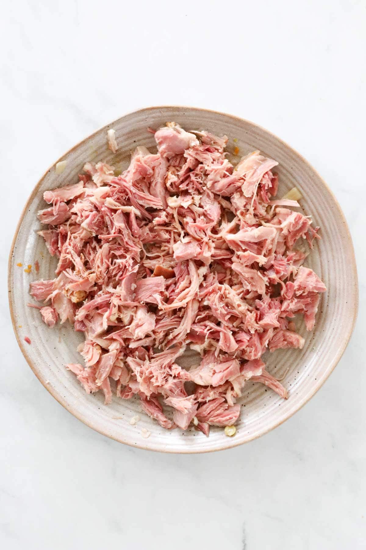 A plate of shredded ham hock.