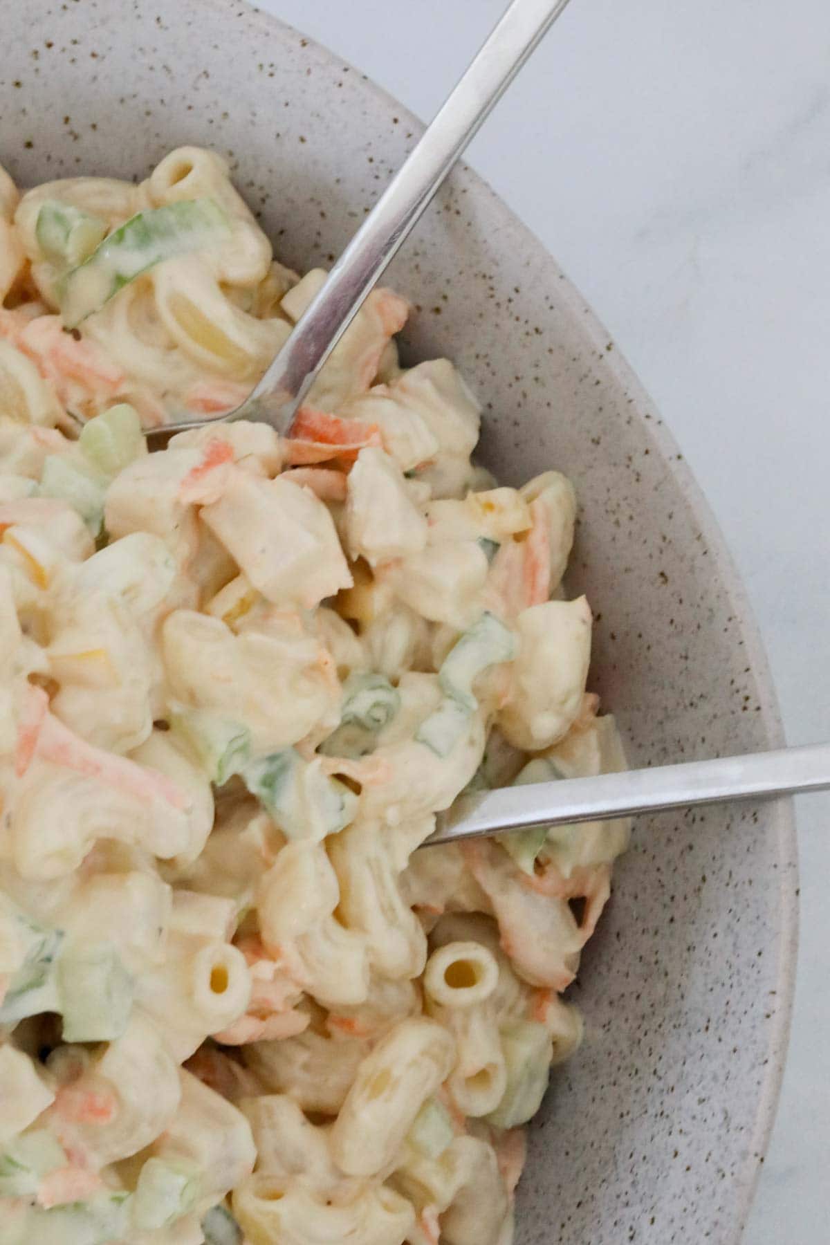 Close up of pasta salad in a serving bowl.