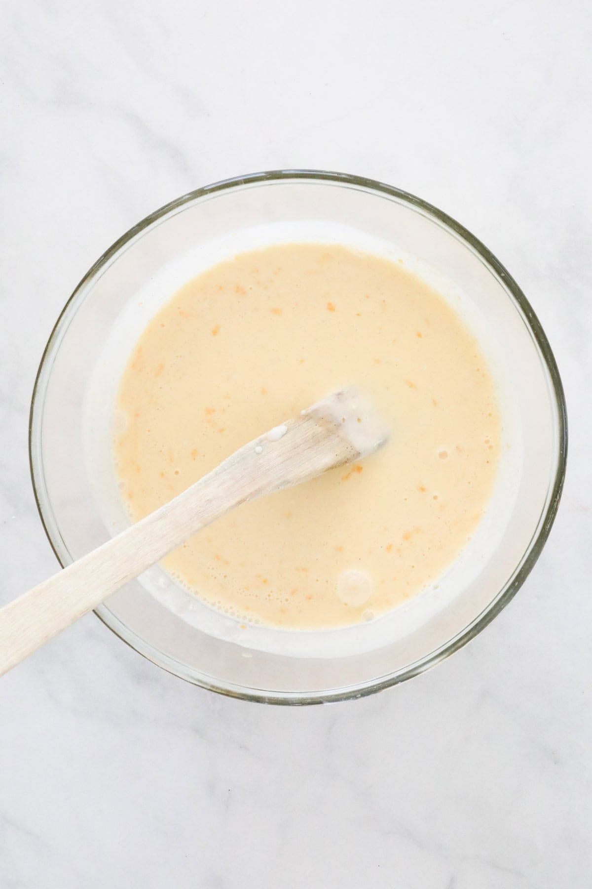 The combined egg and cream mixture in a bowl.