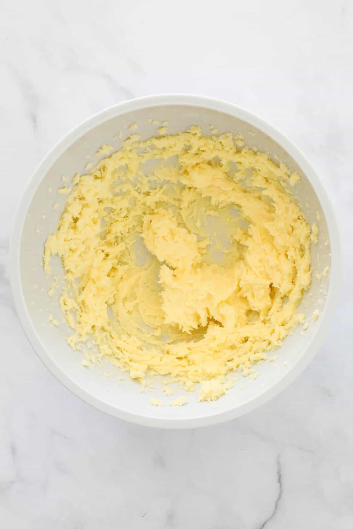 Creamed butter and sugar in a mixing bowl.