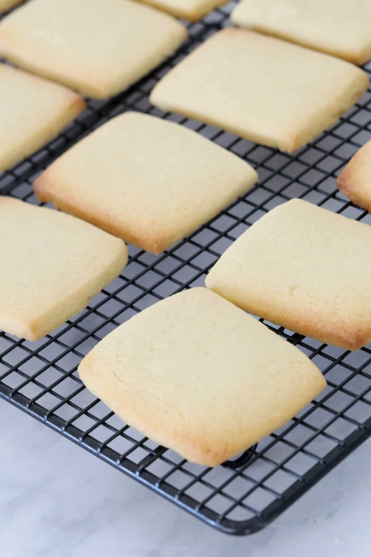 Rectangular baked cookies on a wire cooling rack.