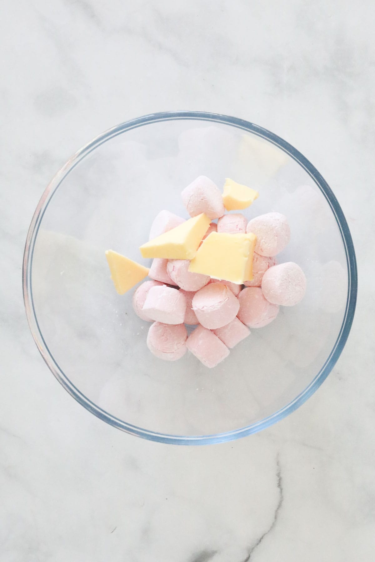 Marshmallows and butter in a microwave-safe bowl.