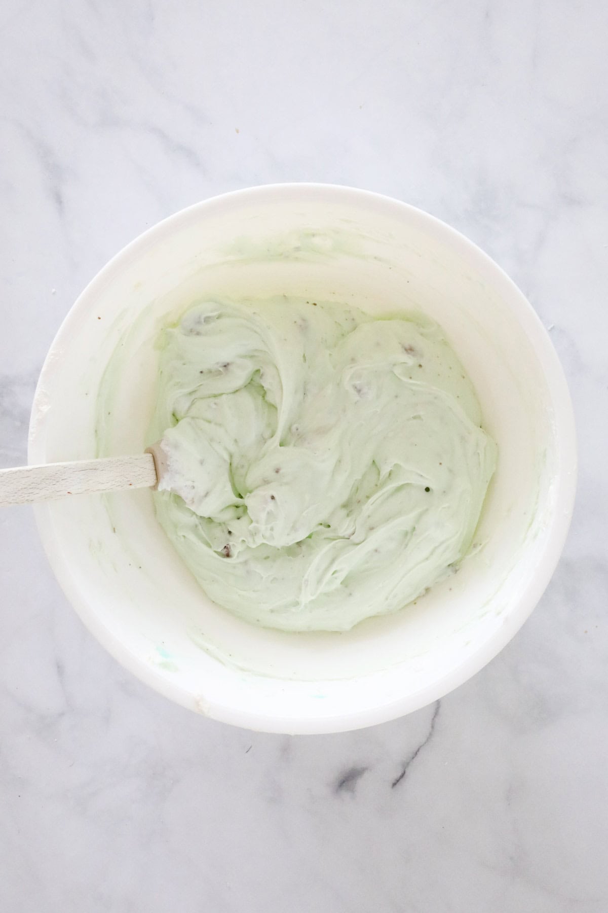 The combined cheesecake filling in the mixing bowl.