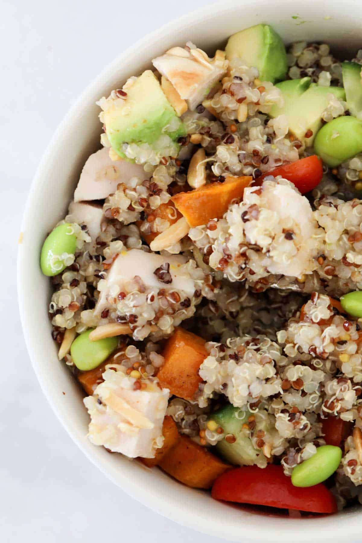 A chicken and sweet potato quinoa bowl once all the ingredients are mixed together.