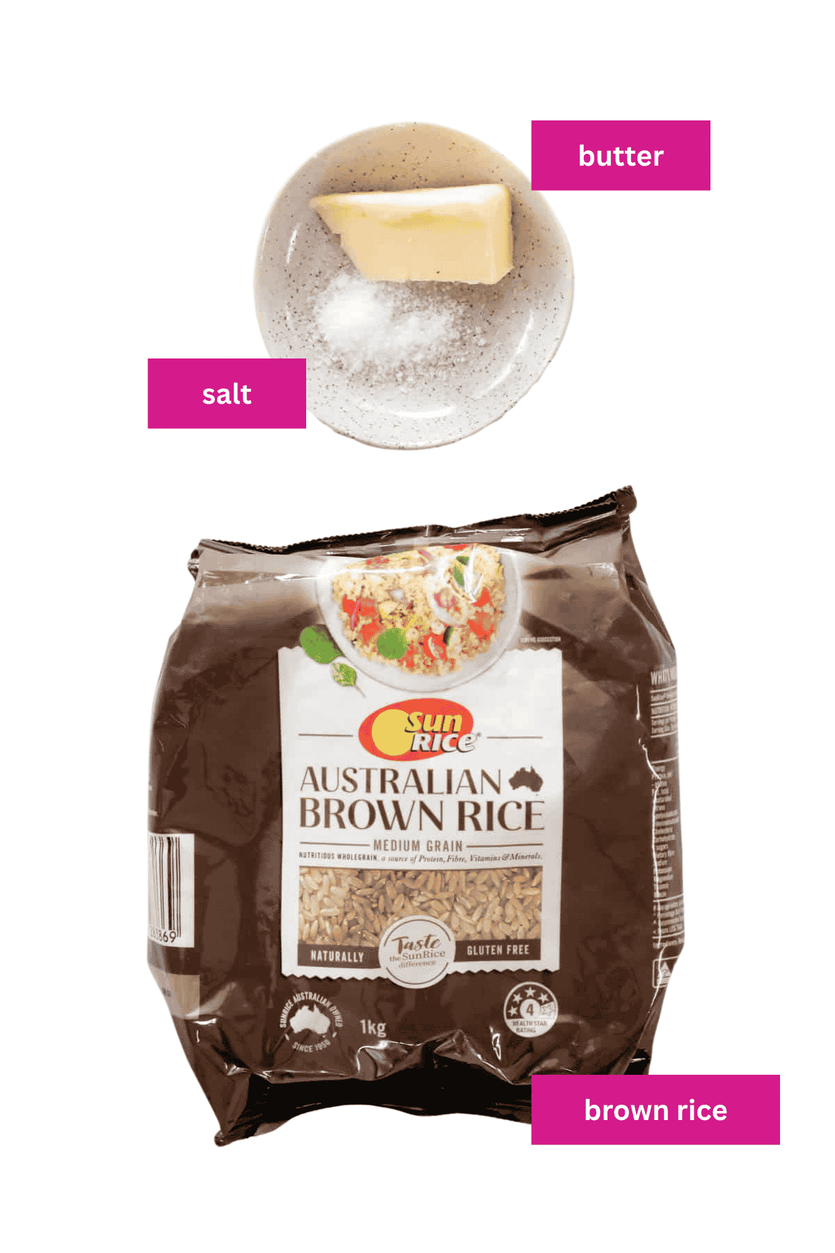 Brown rice, salt and butter laid out on a white background.