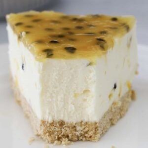 A half eaten slice of no bake passionfruit cheesecake.