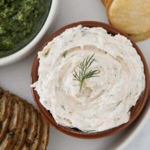 A bowl of homemade smoked salmon dip with crackers.