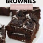 Squares of brownie with chunks of Oreo's on top.