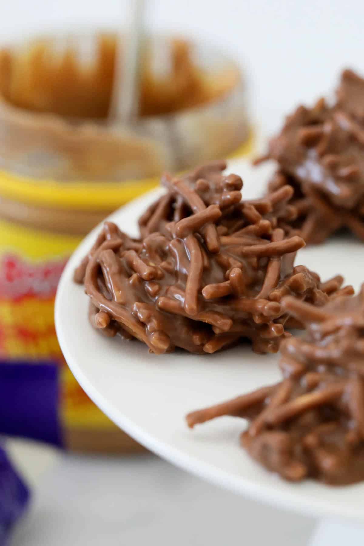 Close up of chocolate spiders on a cake stand.