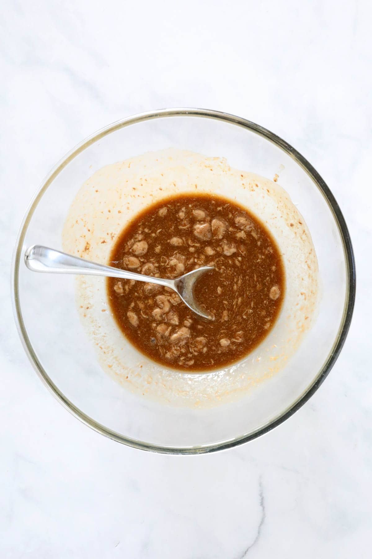 The melted butter and golden syrup, with Mars Bars partially melted in a bowl.