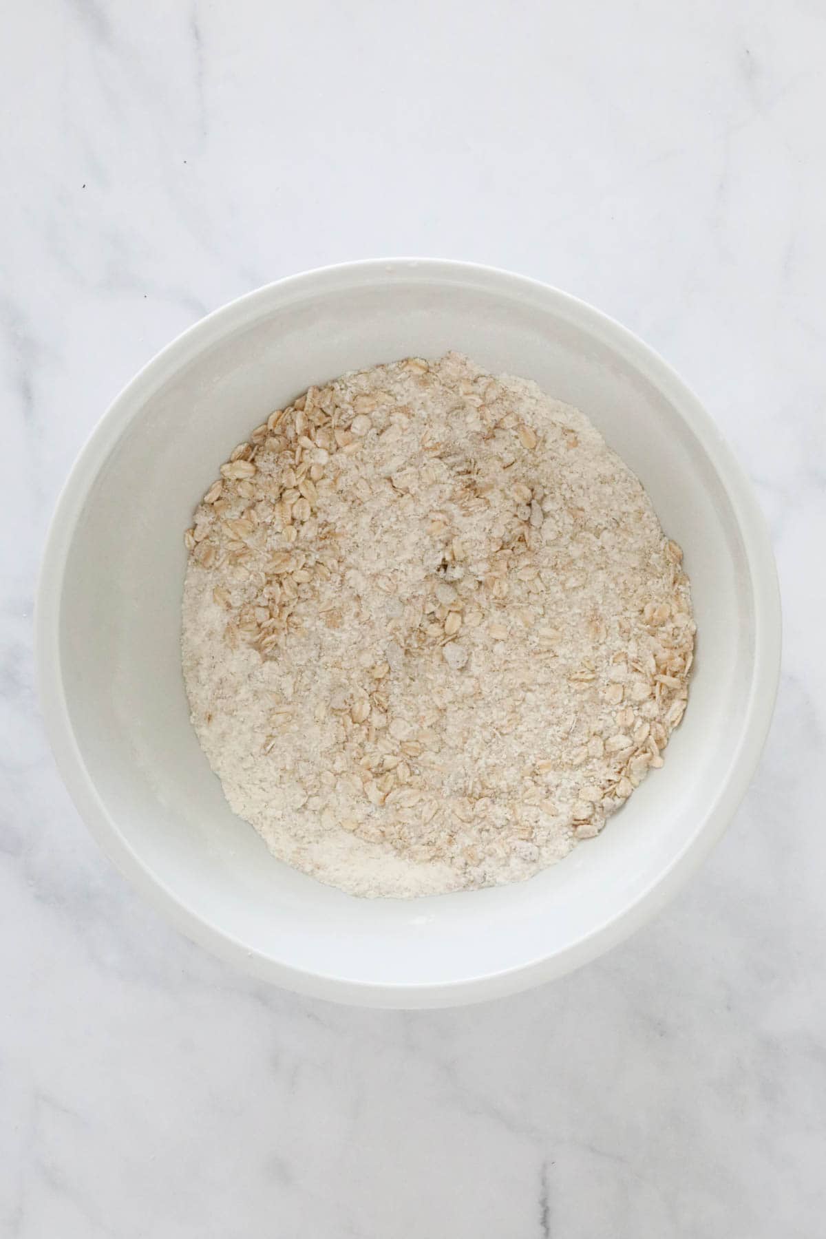 Dry ingredients mixed in a white bowl.