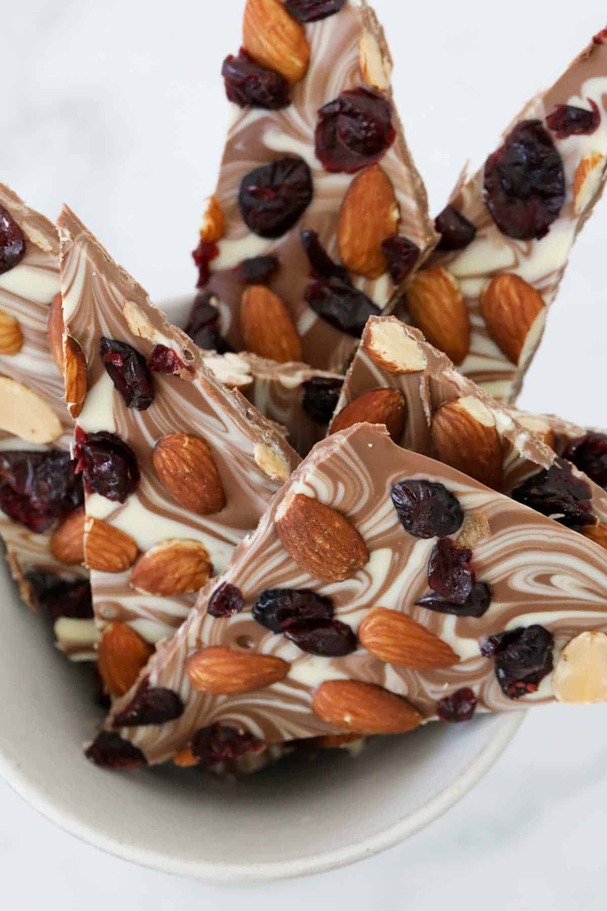 Broken shards of cranberry, almond and chocolate bark.