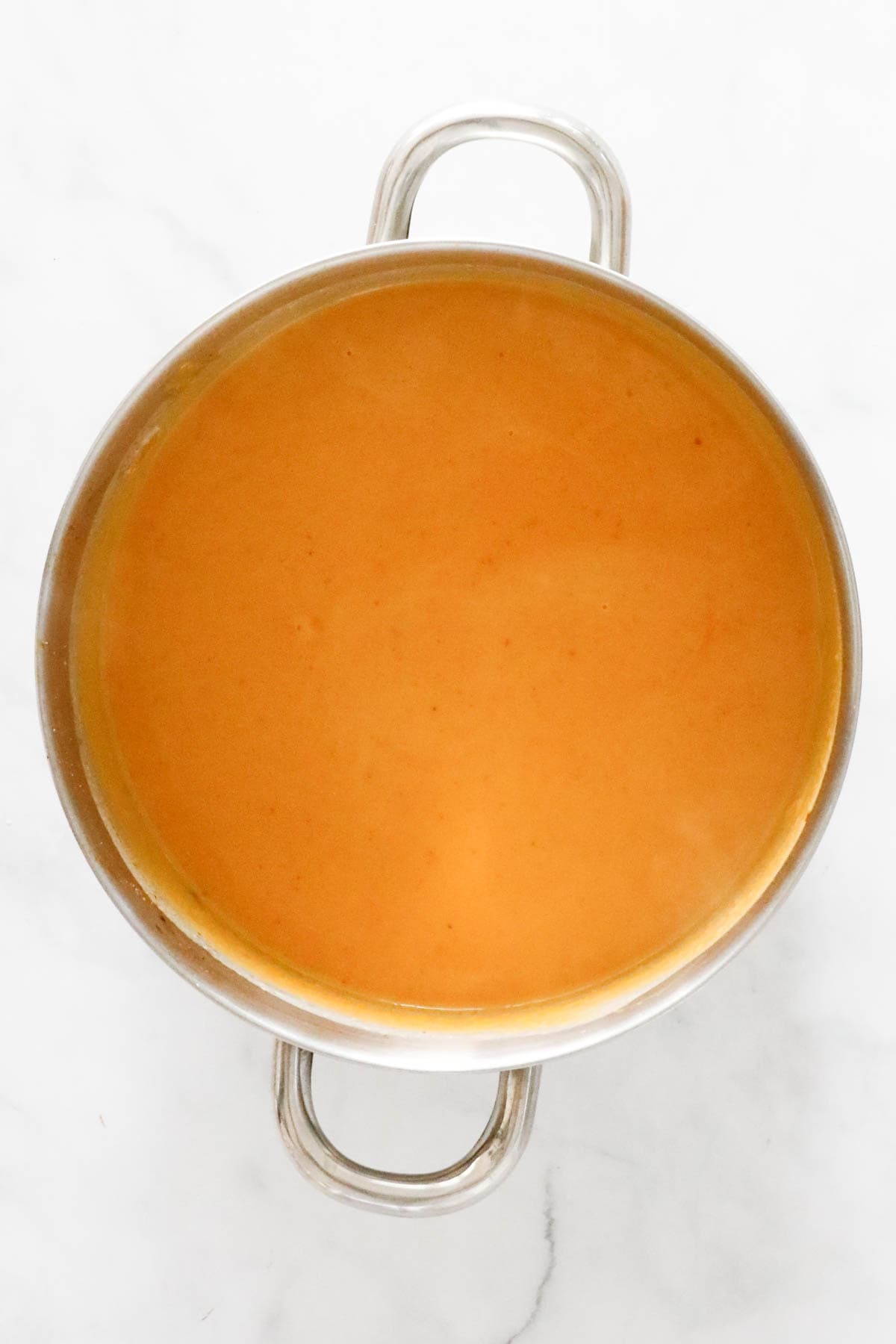 Thai roasted pumpkin soup in a large saucepan.