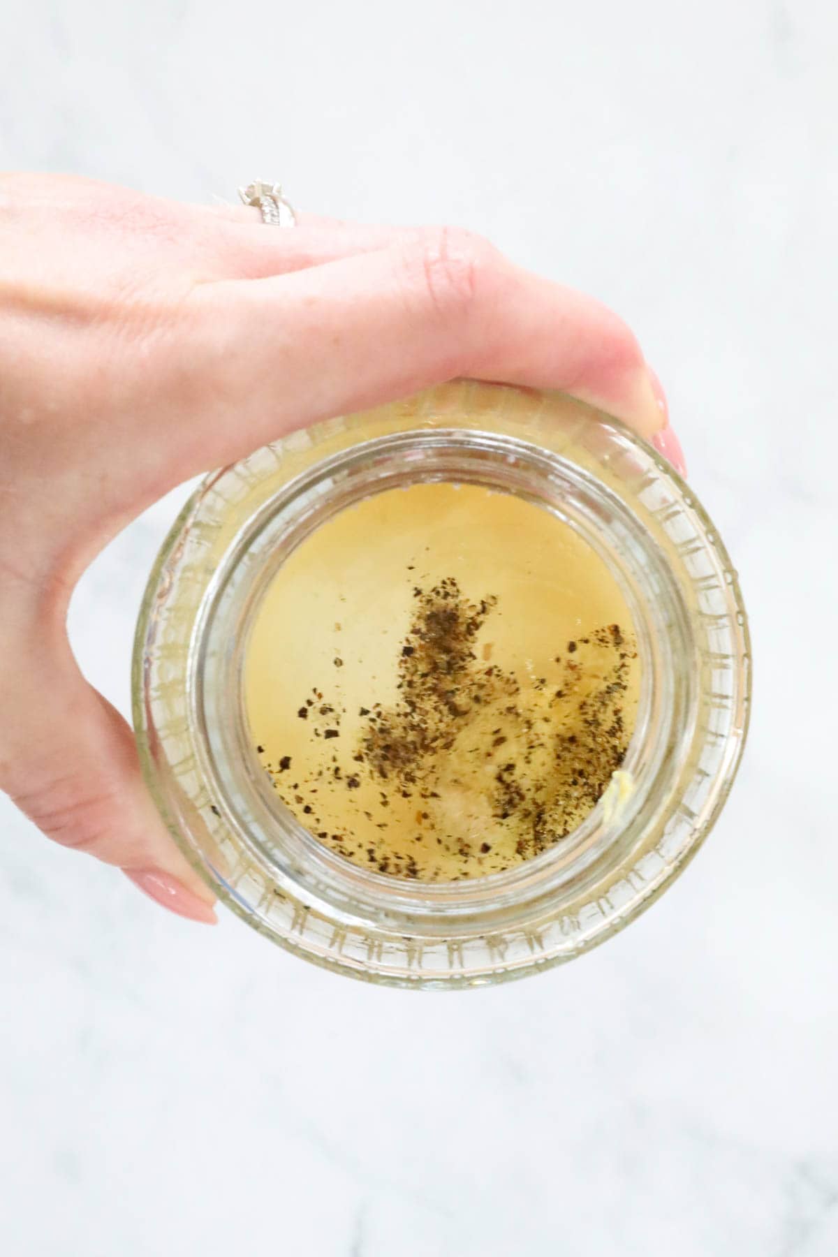 Vinaigrette ingredients in a small jar.