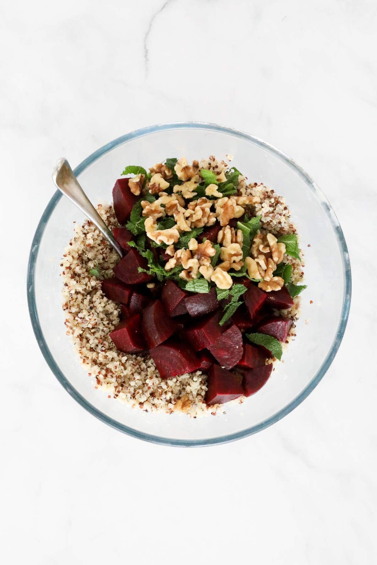 Chopped beetroot chunks, chopped walnuts and mint leaves added to the bowl of quinoa.