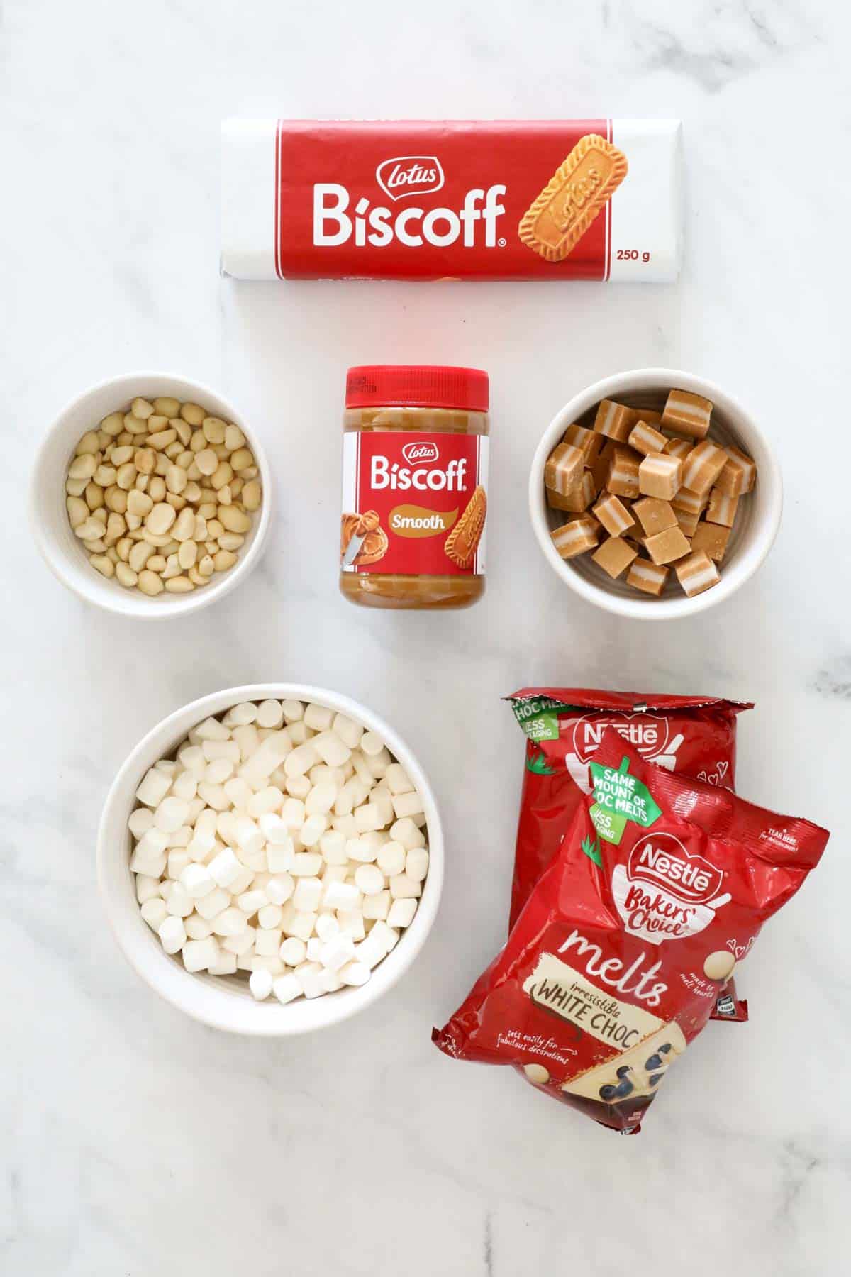 Ingredients for Biscoff Rocky Road placed on a bench.