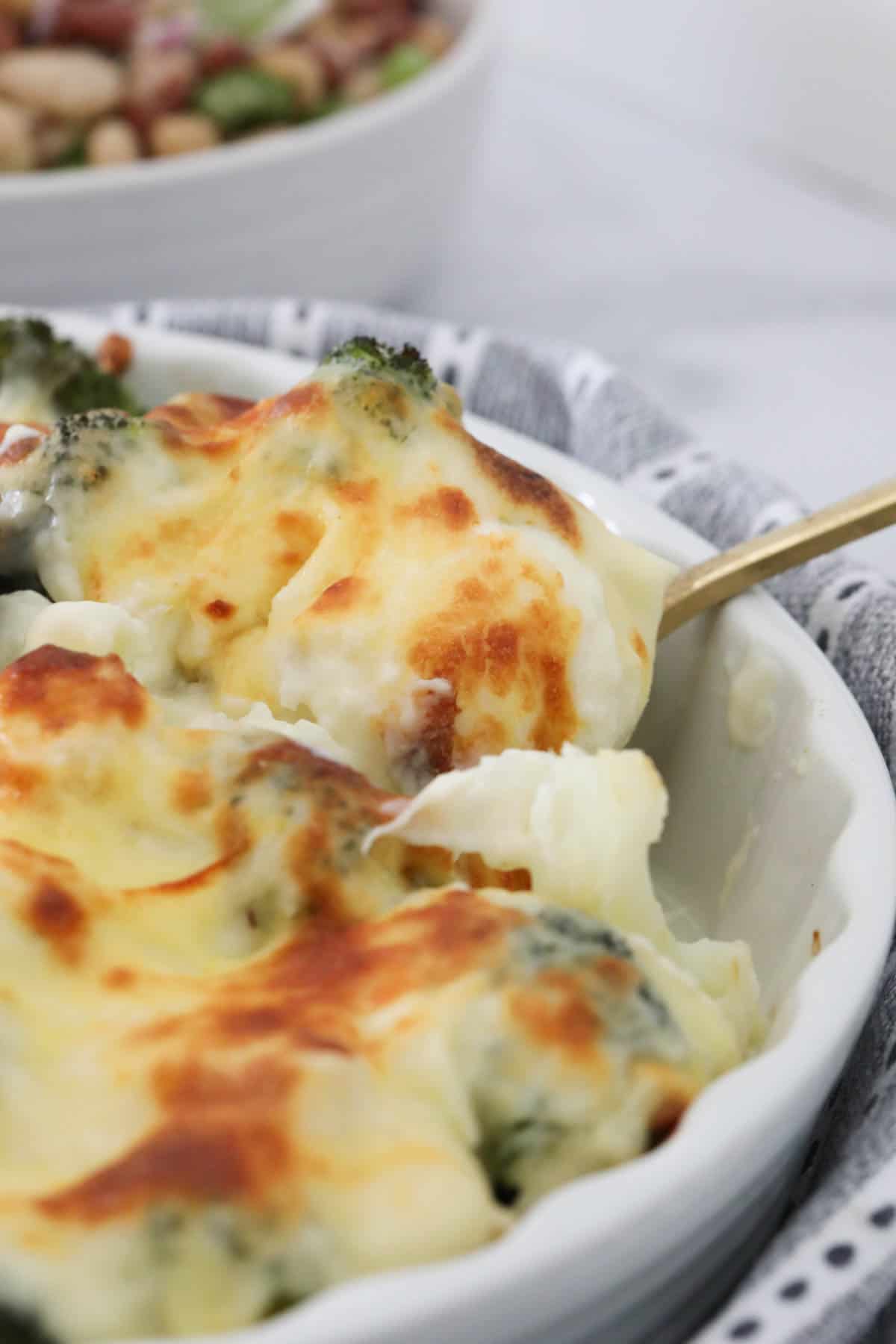 Cheesy mornay sauce on vegetables. 