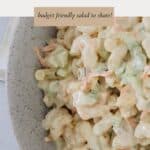 A bvowl of chicken macaroni salad with a creamy mayo dressing.