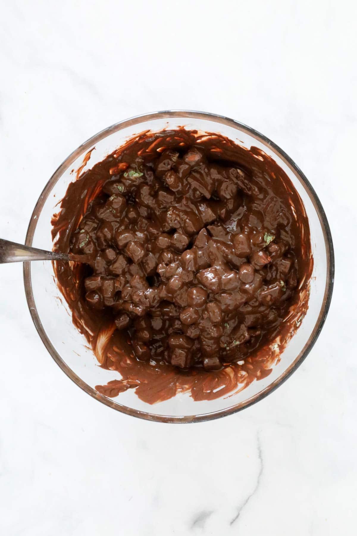 Chunks of chocolate bars and Mint Slice biscuits mixed through melted dark chocolate,